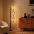 Brightech 3-Ring Modern Floor Lamp Matches Living Room Décor - Contemporary Arc Tall Lamp with 3-Circle Ring-Style Pendant - Over The Couch Standing on Arching Pole - Eclectic- Black